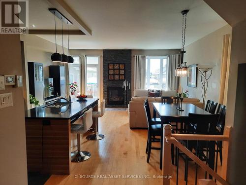 730 Teasel Way, Ottawa (Gloucester), ON - Indoor Photo Showing Dining Room With Fireplace