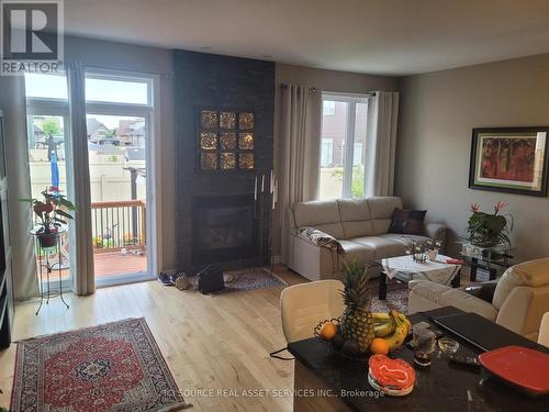 730 Teasel Way, Ottawa (Gloucester), ON - Indoor Photo Showing Living Room With Fireplace