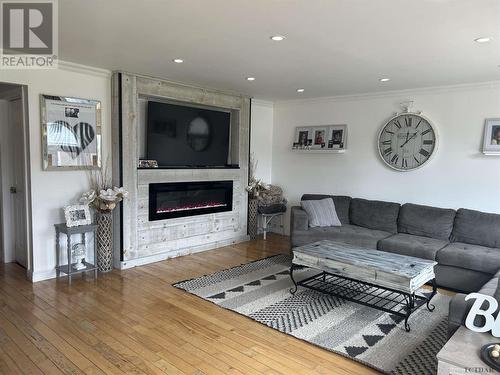 136 Eric Cres, Timmins, ON - Indoor Photo Showing Living Room With Fireplace