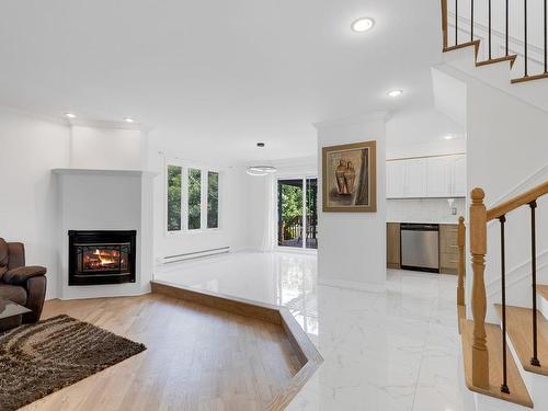 Hall - 3425 Ch. De La Rivière-Cachée, Boisbriand, QC - Indoor Photo Showing Living Room With Fireplace