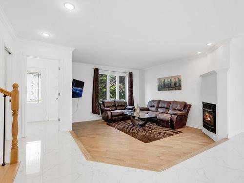 Living room - 3425 Ch. De La Rivière-Cachée, Boisbriand, QC - Indoor Photo Showing Other Room With Fireplace