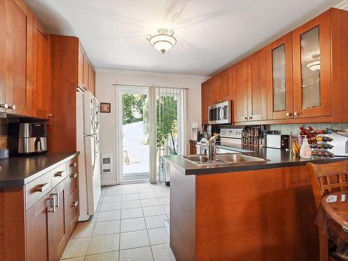 Kitchen - 413 Av. Marc-Aurèle-Fortin, Laval (Sainte-Rose), QC - Indoor Photo Showing Kitchen With Double Sink