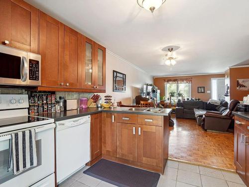 Cuisine - 413 Av. Marc-Aurèle-Fortin, Laval (Sainte-Rose), QC - Indoor Photo Showing Kitchen With Double Sink