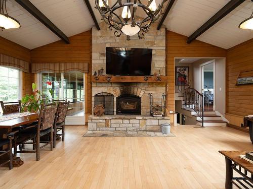 Family room - 2026 Mtée Herdman, Hinchinbrooke, QC - Indoor Photo Showing Dining Room With Fireplace