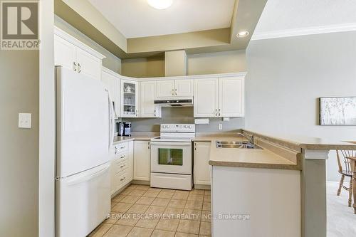 307 - 262 Dundas Street E, Hamilton (Waterdown), ON - Indoor Photo Showing Kitchen With Double Sink