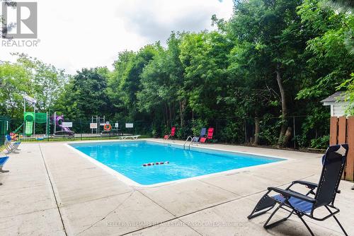 802 - 3145 Queen Frederica Drive, Mississauga (Applewood), ON - Outdoor With In Ground Pool With Backyard