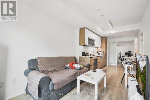 301 - 150 Logan Avenue, Toronto (South Riverdale), ON - Indoor Photo Showing Living Room