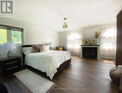 36 Crompton Drive, Barrie (Little Lake), ON - Indoor Photo Showing Bedroom With Fireplace