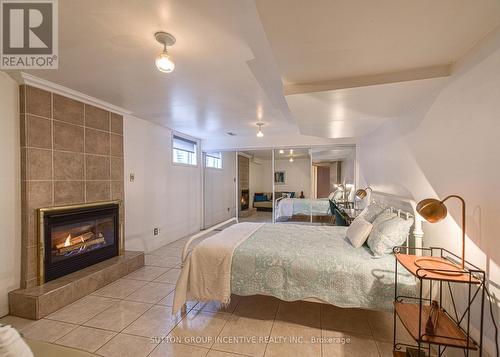 36 Crompton Drive, Barrie (Little Lake), ON - Indoor Photo Showing Bedroom With Fireplace