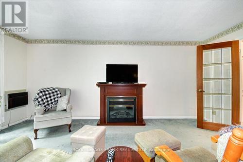 308 - 1111 Water Street, Peterborough (Northcrest), ON - Indoor Photo Showing Living Room With Fireplace