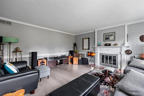 1996 Tomat Avenue, Kelowna, BC - Indoor Photo Showing Living Room With Fireplace