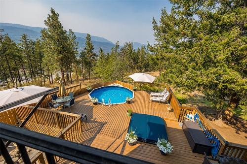 1996 Tomat Avenue, Kelowna, BC - Outdoor With Above Ground Pool With Deck Patio Veranda