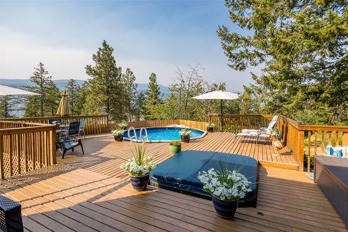 1996 Tomat Avenue, Kelowna, BC - Outdoor With Above Ground Pool With Deck Patio Veranda With Exterior