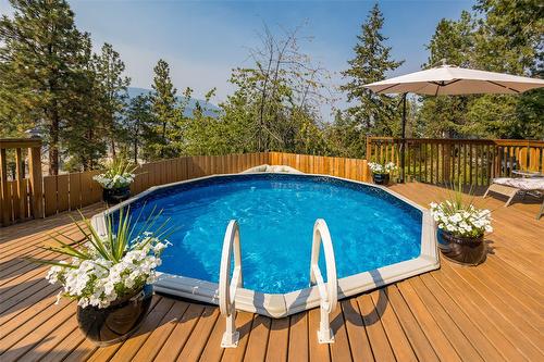 1996 Tomat Avenue, Kelowna, BC - Outdoor With Above Ground Pool With Deck Patio Veranda With Backyard