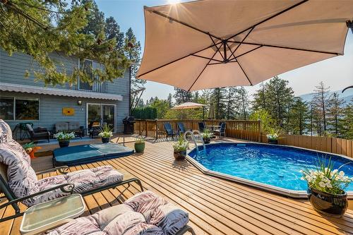 1996 Tomat Avenue, Kelowna, BC - Outdoor With Above Ground Pool With Deck Patio Veranda