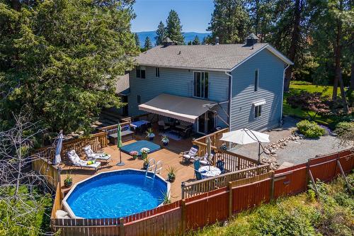 1996 Tomat Avenue, Kelowna, BC - Outdoor With Above Ground Pool With Deck Patio Veranda