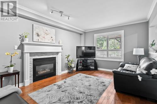 4 Mcivor Street, Whitby (Rolling Acres), ON - Indoor Photo Showing Living Room With Fireplace