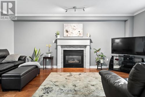 4 Mcivor Street, Whitby (Rolling Acres), ON - Indoor Photo Showing Living Room With Fireplace