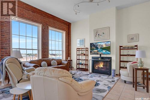 510 1275 Broad Street, Regina, SK - Indoor Photo Showing Living Room With Fireplace