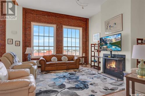 510 1275 Broad Street, Regina, SK - Indoor Photo Showing Living Room With Fireplace