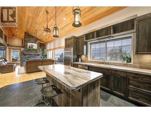 15042 Oyama Road, Lake Country, BC - Indoor Photo Showing Kitchen With Fireplace