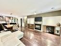 Vue d'ensemble - 201-2160 Rue Bonaventure, Laval (Sainte-Dorothée), QC  - Indoor Photo Showing Living Room With Fireplace 