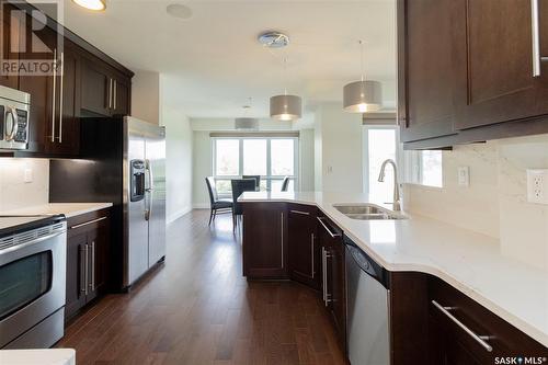 508 902 Spadina Crescent E, Saskatoon, SK - Indoor Photo Showing Kitchen With Double Sink With Upgraded Kitchen