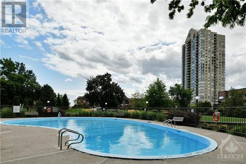 270 Brittany Drive Unit#307, Ottawa, ON - Outdoor With In Ground Pool With Backyard