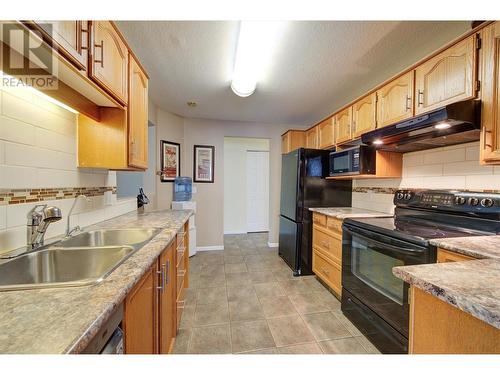 797 Leon Avenue Unit# 208, Kelowna, BC - Indoor Photo Showing Kitchen With Double Sink