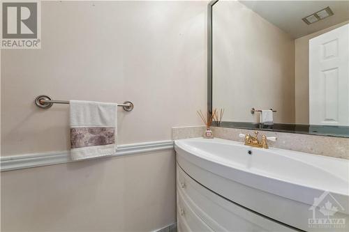 updated main flor powder room Vanity from Ashley - 1410 Palmerston Drive, Ottawa, ON - Indoor Photo Showing Bathroom