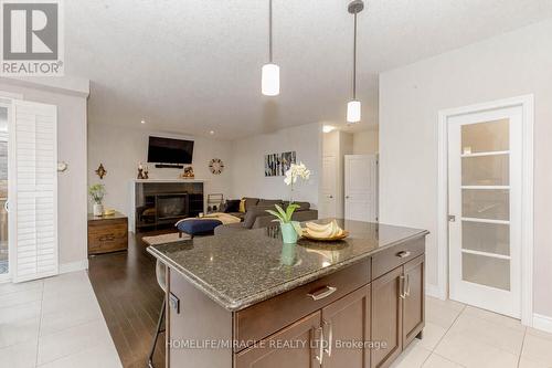 32 Mcintyre Lane, East Luther Grand Valley (Grand Valley), ON - Indoor Photo Showing Kitchen With Fireplace