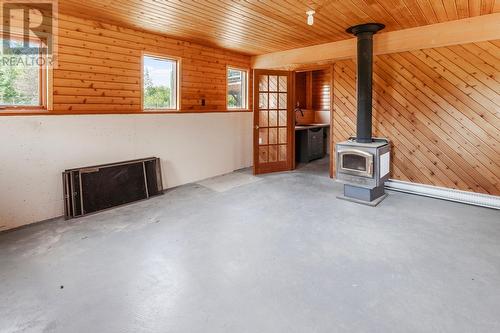 4581 Samuelson Road, Canyon, BC - Indoor Photo Showing Other Room With Fireplace