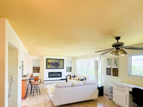 4609 41St Street, Osoyoos, BC - Indoor Photo Showing Living Room With Fireplace