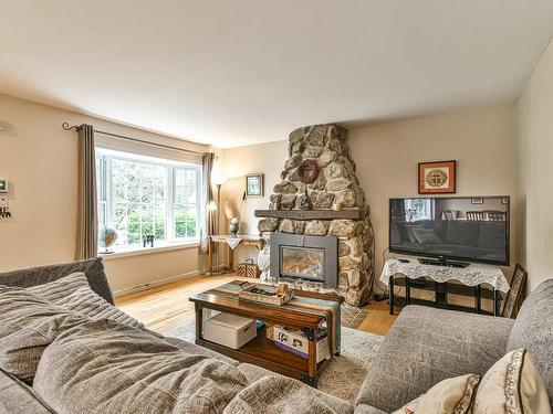 Living room - 50 Av. Carmen, Saint-Sauveur, QC - Indoor Photo Showing Living Room With Fireplace