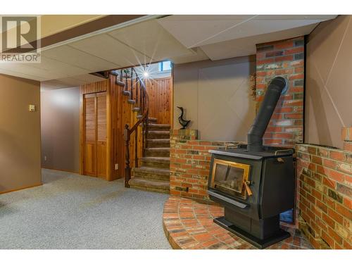 3918 Macgregor West  Road, Nelson, BC - Indoor Photo Showing Basement With Fireplace