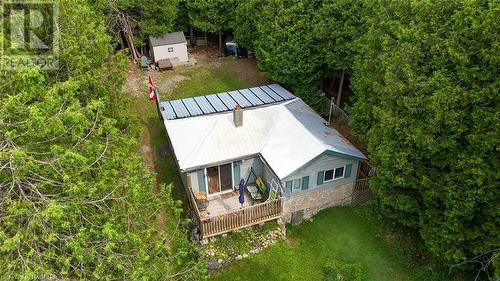 Featuring a large deck and steel roof. - 615 Stokes Bay Rd, North Bruce Peninsula, ON - Outdoor