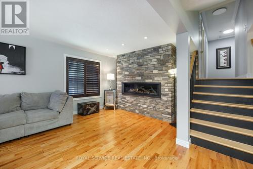 419 Spillsbury Drive, Peterborough (Otonabee), ON - Indoor Photo Showing Living Room With Fireplace