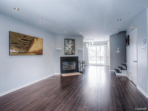 Vue d'ensemble - 6470 Rue Émile-Augier, Laval (Laval-Ouest), QC - Indoor Photo Showing Living Room With Fireplace