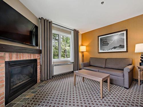 Living room - 231-232-160 Ch. Du Curé-Deslauriers, Mont-Tremblant, QC - Indoor Photo Showing Living Room With Fireplace