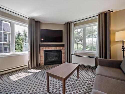 Living room - 231-232-160 Ch. Du Curé-Deslauriers, Mont-Tremblant, QC - Indoor Photo Showing Living Room With Fireplace