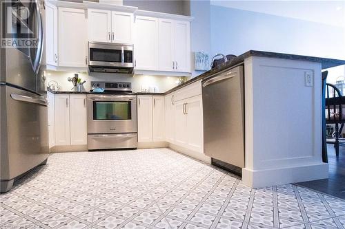 Beautiful Tile kitchen flooring - 945 3Rd Avenue East Unit# 313, Owen Sound, ON - Indoor Photo Showing Kitchen With Stainless Steel Kitchen