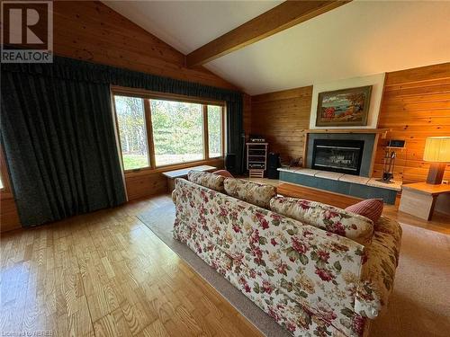 410A Niagara Road, Nipissing, ON - Indoor Photo Showing Living Room With Fireplace