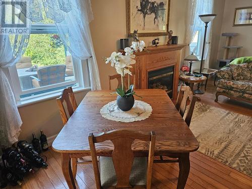 601 Valhalla Road, Nelson, BC - Indoor Photo Showing Dining Room With Fireplace