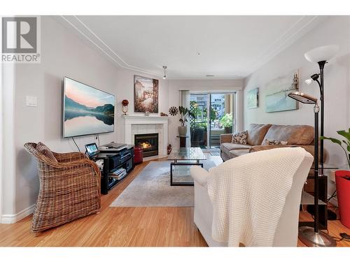 2255 Atkinson Street Unit# 106, Penticton, BC - Indoor Photo Showing Living Room With Fireplace