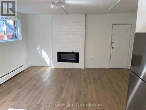 894 Adelaide Street N, London, ON - Indoor Photo Showing Other Room With Fireplace