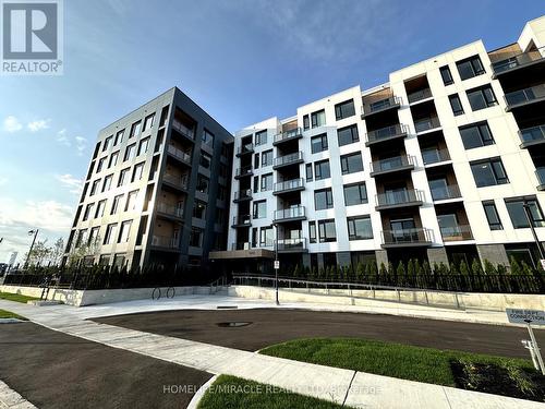 615 - 1440 Clarriage Court, Milton (Ford), ON - Outdoor With Balcony With Facade