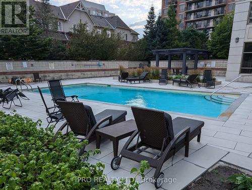 1111 - 2391 Central Park Drive, Oakville (Uptown Core), ON - Outdoor With In Ground Pool