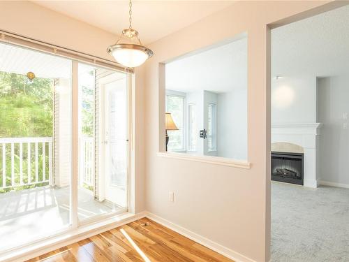 207-5660 Edgewater Lane, Nanaimo, BC - Indoor Photo Showing Other Room With Fireplace