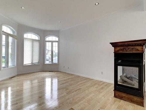 Salon - 7650 Rue Laffite, Brossard, QC - Indoor Photo Showing Other Room With Fireplace