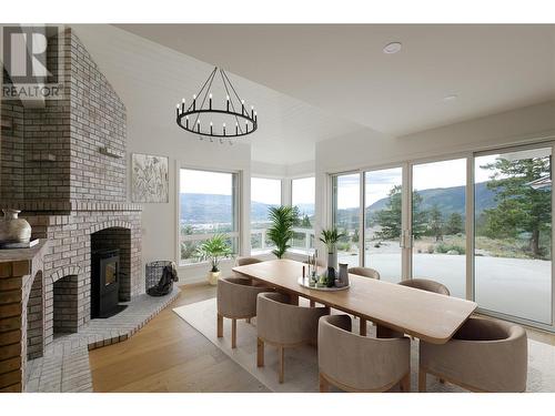 2632 Forsyth Drive, Penticton, BC - Indoor Photo Showing Dining Room With Fireplace